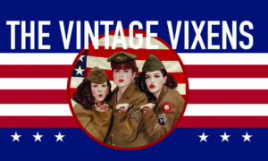 Three women in vintage military uniforms pose in front of a stylized American flag with text reading "The Vintage Vixens.